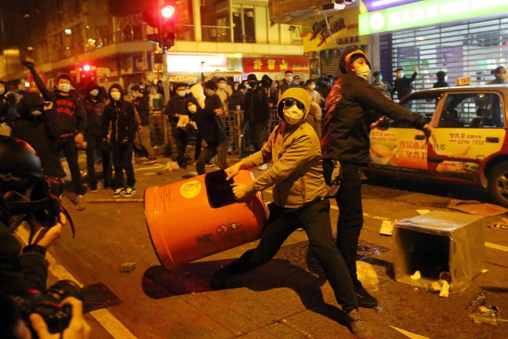 Masked protesters clash with police in Mong Kok during the three-day Lunar New Year holiday in 2016. Photo: Edward Wong