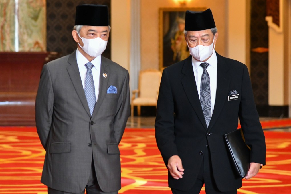 Malaysia‘s King Sultan Abdullah Sultan Ahmad Shah, left, meets Prime Minister Muhyiddin Yassin at the National Palace. Photo: Handout / AFP