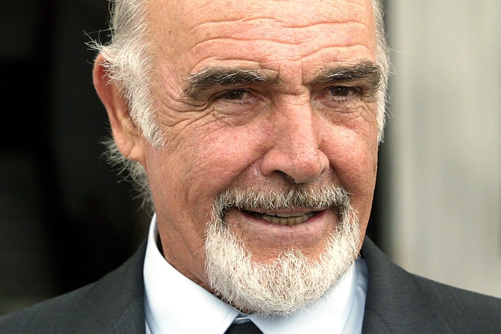 Actor Sean Connery talks with journalists after leaving the presidential palace in Panama City in November 2003. Photo: AFP