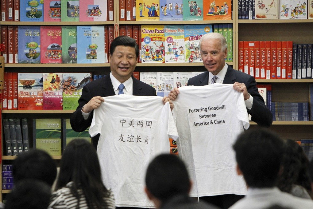 President Xi Jinping and then-US vice-president Joe Biden hold T-shirts given to them by students during their visit to the International Studies Learning Centre in South Gate, California, on February 17, 2012. Improving the bilateral relationship is essential to ensuring prosperity for both countries and the wider world. Photo: AP