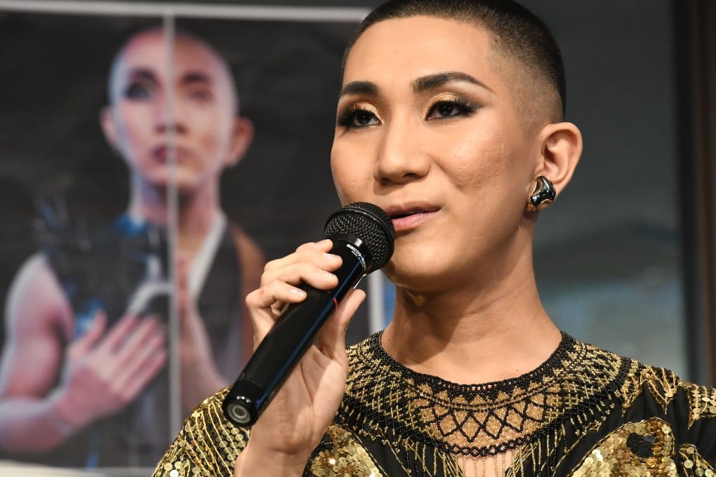 Japanese make-up artist and Buddhist monk Kodo Nishimura speaks at Waseda University in Tokyo. Immaculately made up, sporting smoky eyeshadow, false lashes and winged eyeliner, he changed outfits three times during a presentation. At his monastery he wears a monk’s robe. Photo: AFP
