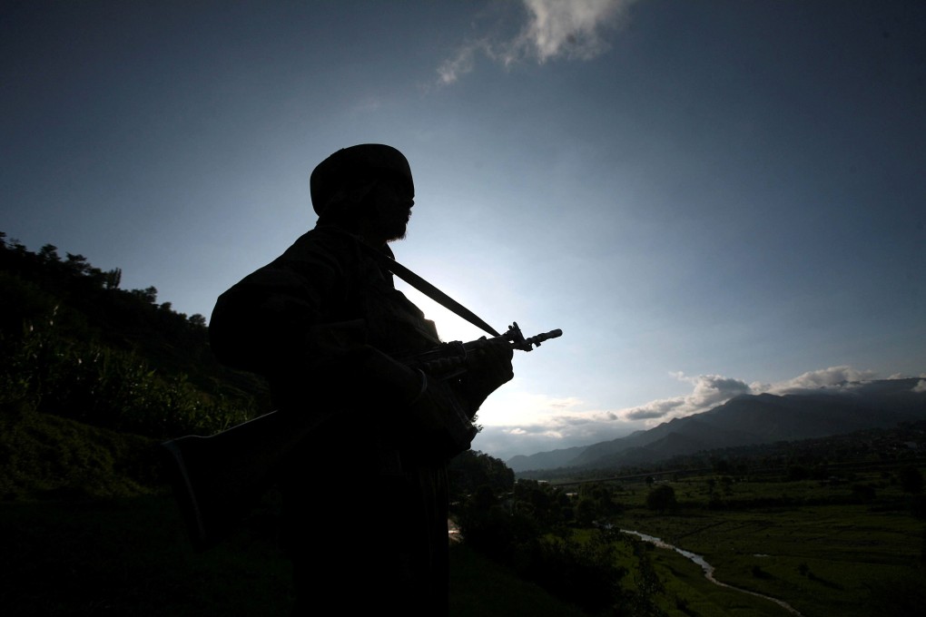 An Indian soldier pictured on patrol near the Line of Control ceasefire line dividing Kashmir between India and Pakistan. Photo: Reuters
