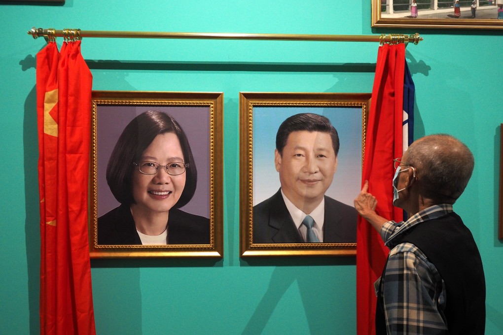 Portraits of Taiwanese President Tsai Ing-wen and Chinese President Xi Jinping are displayed side by side at an exhibition highlighting post-Cold War international relations, at the Taipei Fine Arts Museum on October 22. Photo: EPA-EFE