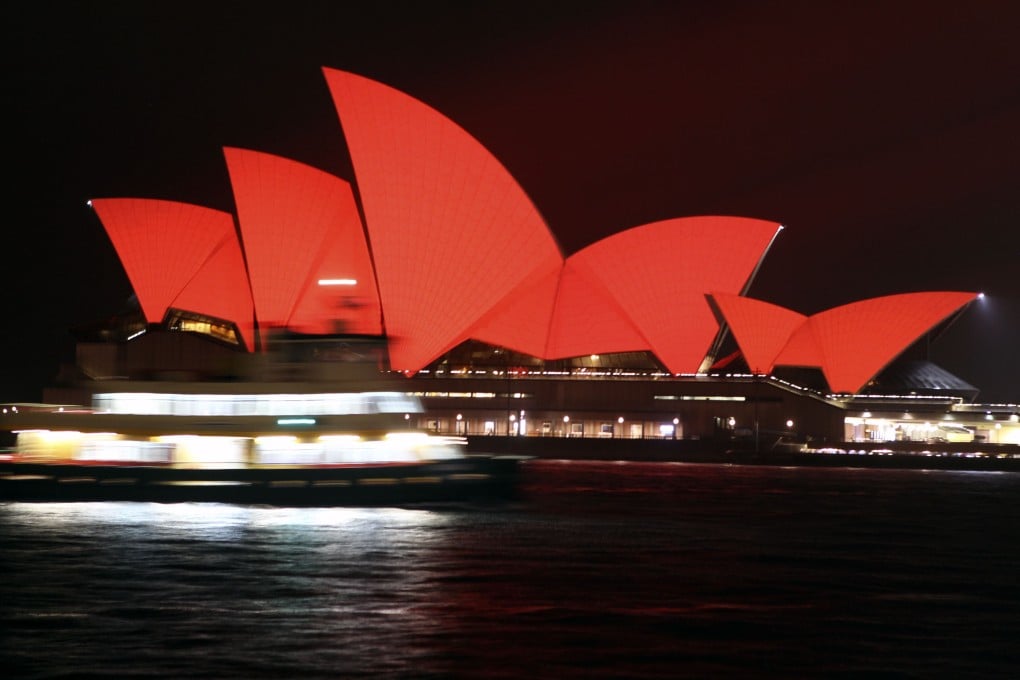 Sydney Opera House lights up in red to celebrate Lunar New Year. Photo: Xinhua