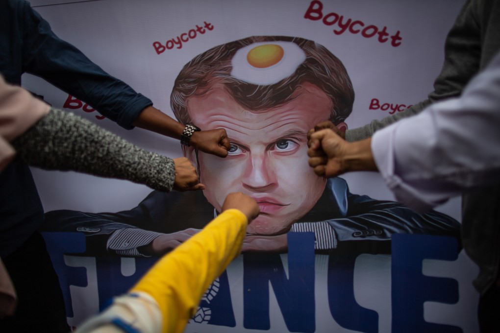 People take part in a rally against French President Emmanuel Macron outside the French embassy in Jakarta, Indonesia on Monday. Photo: dpa