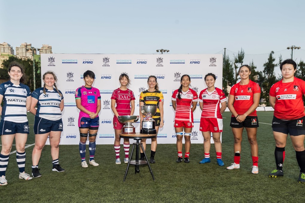 KPMG Women’s Premiership 2020-21 captains pose with the league and cup trophies at Kings Park Sports Ground in Ho Man Tin. Photos: Ike Images
