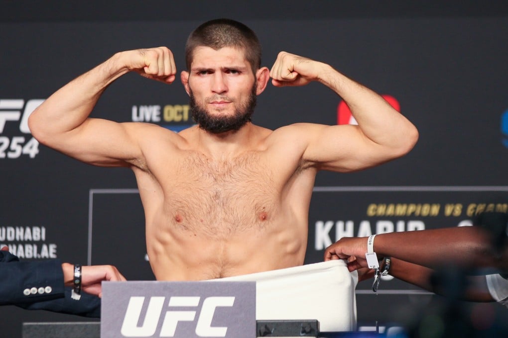 Khabib Nurmagomedov poses on the scale after officially making weight for UFC 254. Photo: Amy Kaplan