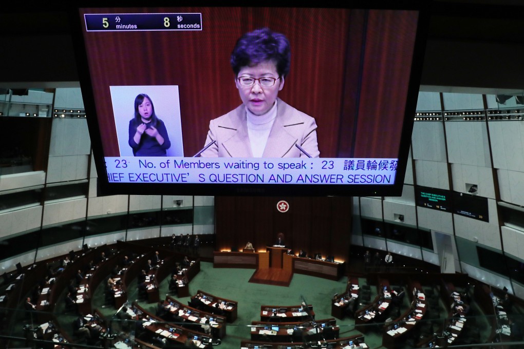 A large screen shows Chief Executive Carrie Lam at a question and answer session in the Legislative Council in January. Photo: Sam Tsang