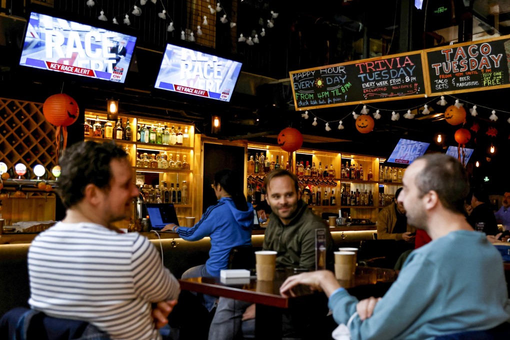 People watch live coverage of the US presidential election at a bar in Beijing. Photo: Reuters