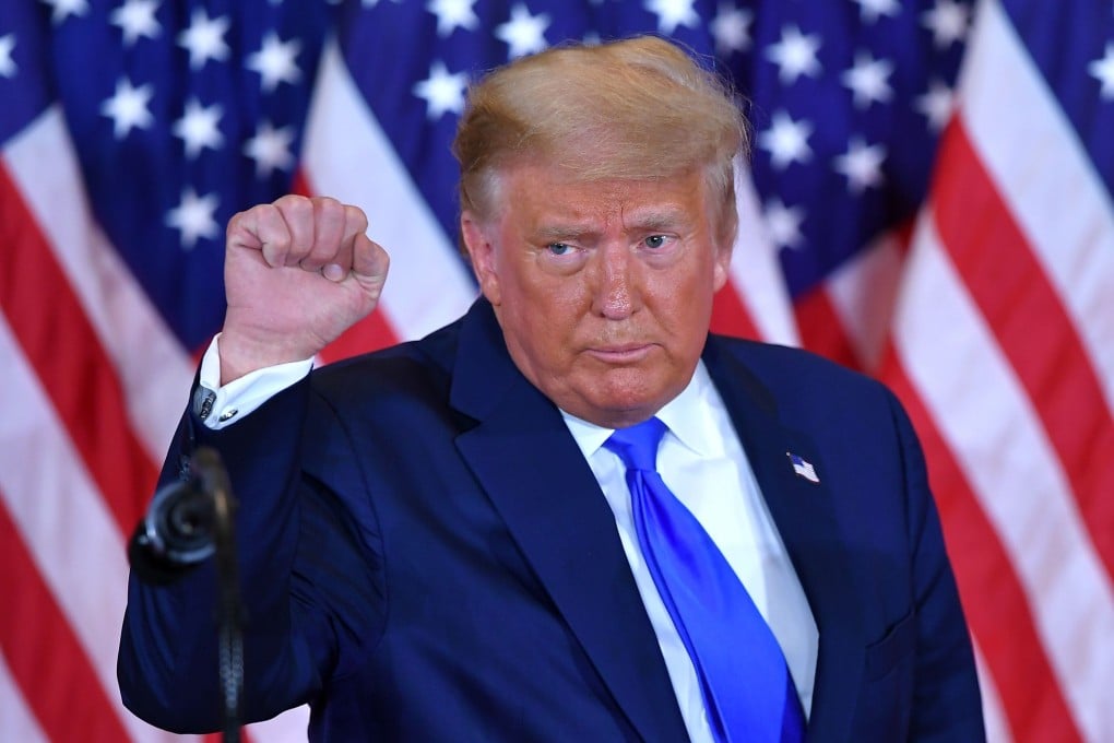 US President Donald Trump’s premature announcement drew cheers from supporters in the room. Photo: AFP