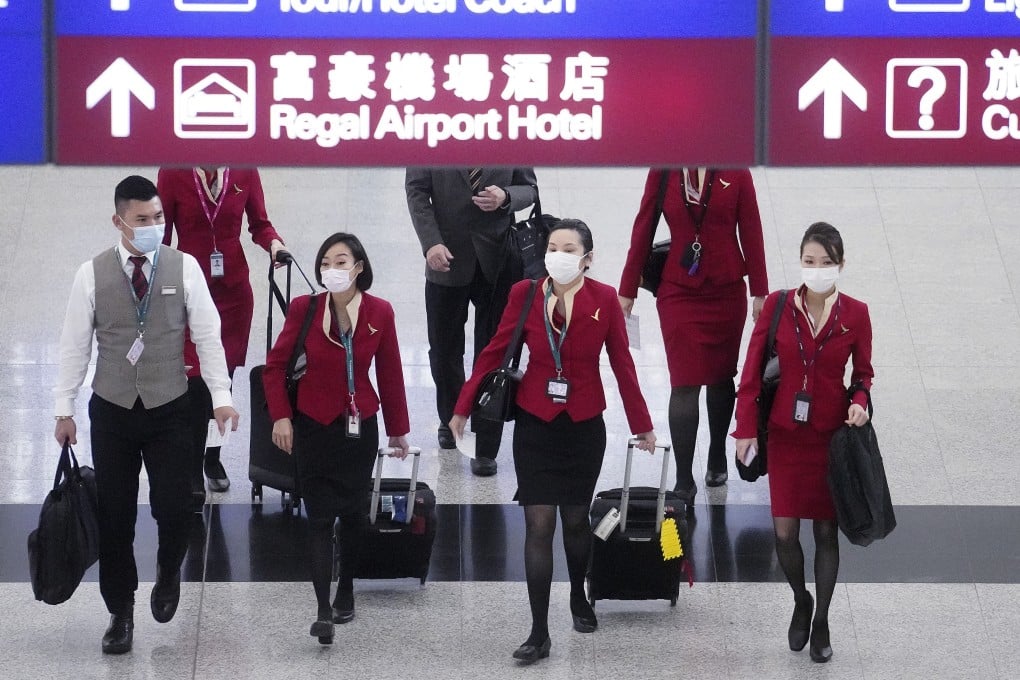 Cathay Pacific staff members in the arrival hall of Hong Kong’s airport. Photo: Winson Wong