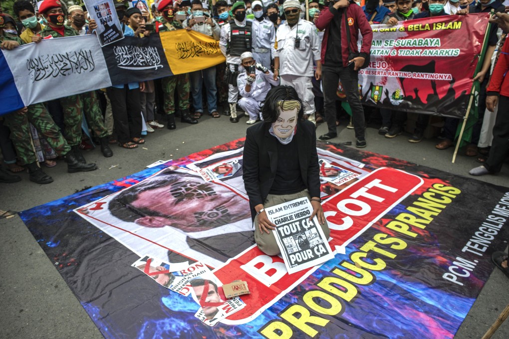 Muslims protesters attend a protest against French President Emmanuel Macron in Surabaya. Photo: AFP