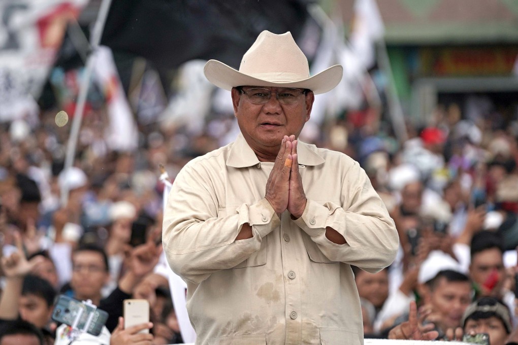 Prabowo Subianto greets supporters of his presidential campaign from a vehicle in Palembang, South Sumatra province, in April 2019. Photo: Bloomberg