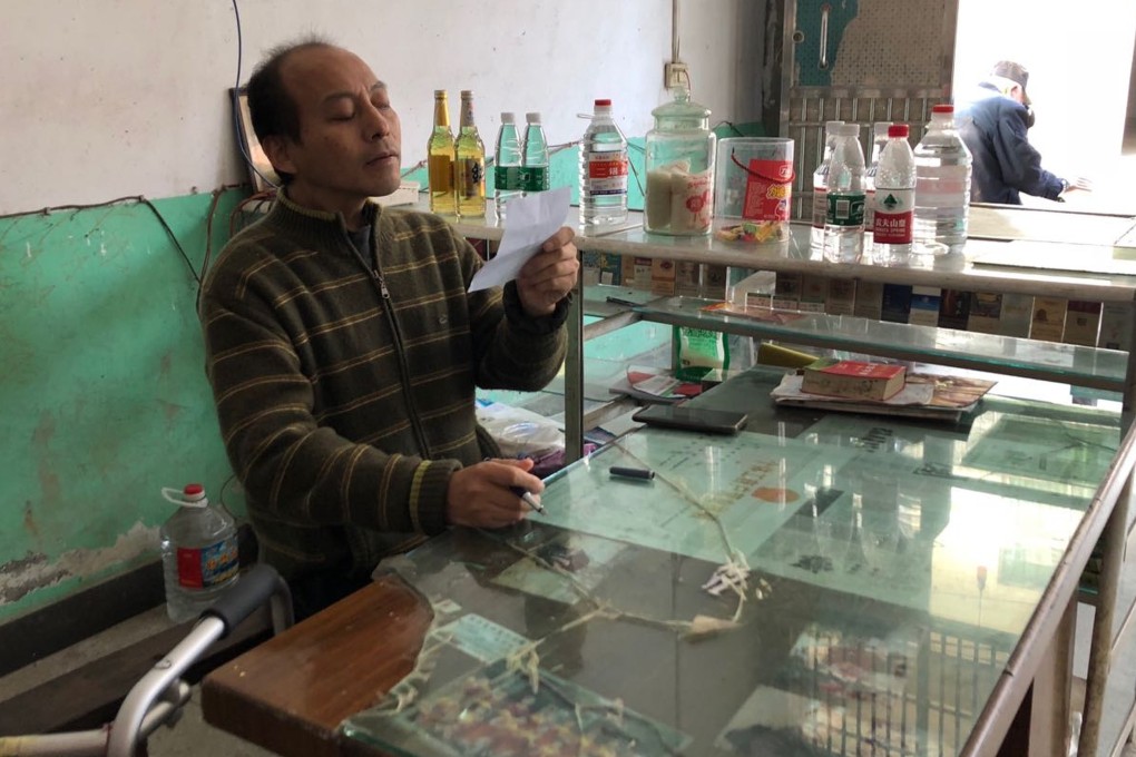 After four surgeries and months of rehabilitation, “folded man” Li Hua is able to run a small stand selling tobacco and alcohol. Photo: Alice Yan