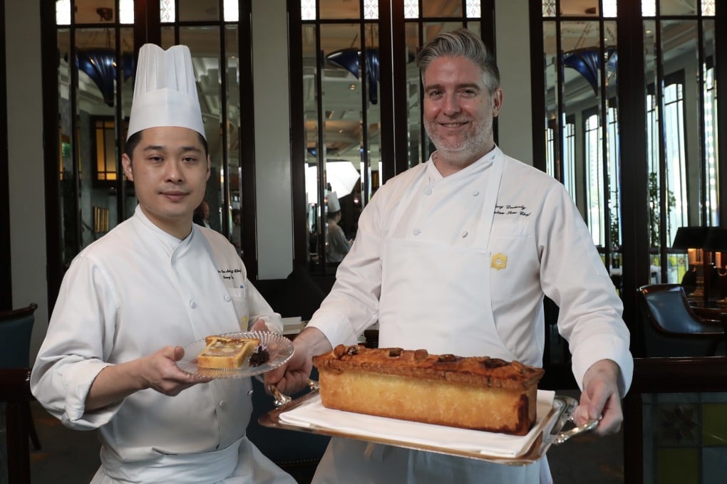 Kenny Chan, head chef, and Cary Docherty, executive sous chef at the Lobster Bar and Grill in the Island Shangri-La hotel in Admiralty, Hong Kong, with their pâté en croute, one of several seasonal game dishes on the menu. Photo: Xiaomei Chen