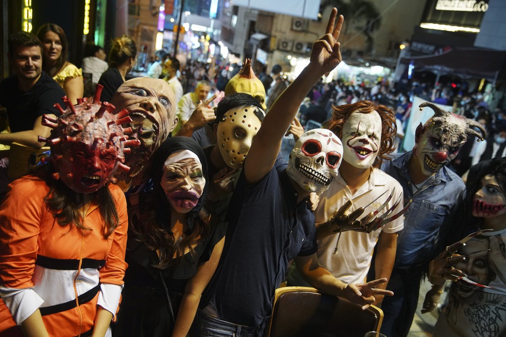 The crowds celebrate Halloween in Lan Kwai Fong, Hong Kong’s nightlife hub, on October 31. Pandemic fatigue and complacence already pose risks for fresh Covid-19 infections, and quarantine exemptions will only make matters worse. Photo: Winson Wong