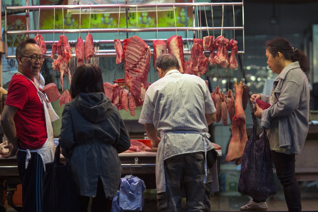 Patrons buy meat from a butcher’s stall in Hong Kong, where the per capita meat consumption rate is among the highest in the world. Photo: EPA