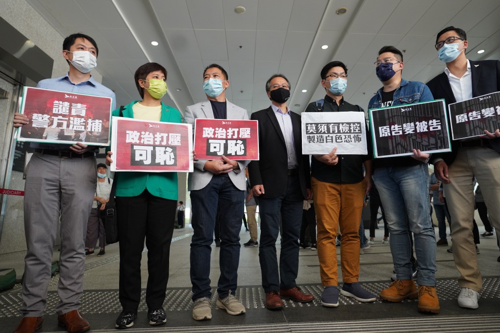 (From left) Ted Hui, Helena Wong, Wu Chi-wai, Fernando Cheung, Steven Kwok and Andrew Wan appear at West Kowloon Court on Friday. Lawmaker Lam Cheuk-ting (far right) attended in support. Photo: Winson Wong