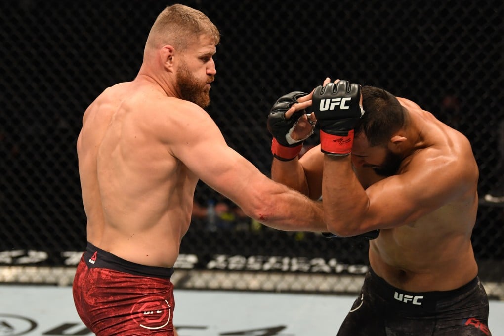 Jan Blachowicz punches Dominick Reyes in their light heavyweight title bout during UFC 253. Photo: Josh Hedges/Zuffa LLC