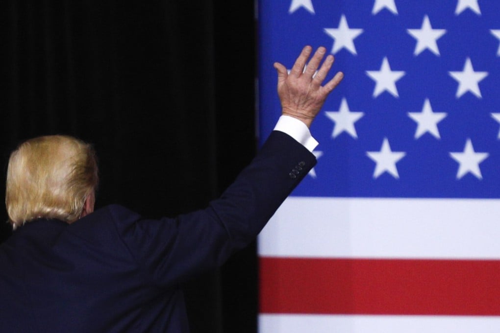 President Donald Trump waves to the audience after a campaign rally in Des Moines, Iowa in January. File photo: AFP