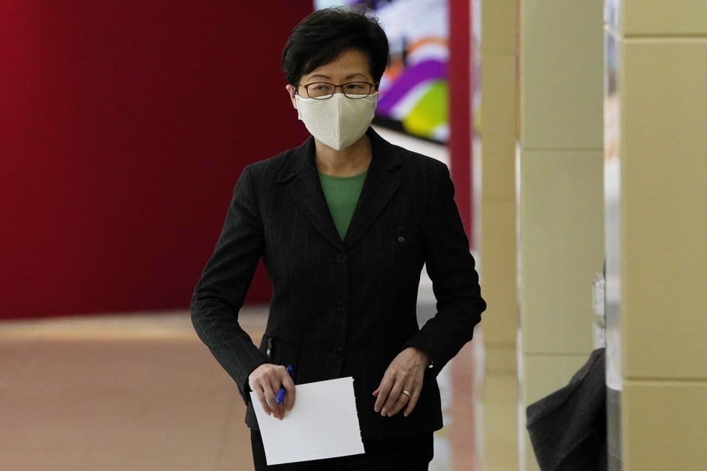 Hong Kong Chief Executive Carrie Lam arrives for a press conference in Beijing on Friday. Photo: AP