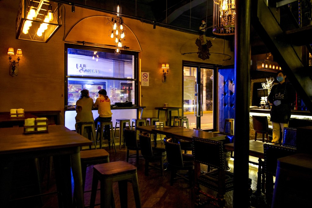 A virtually empty bar in Shanghai before full lockdown, as people steer clear of crowded spaces for fear of catching Covid-19. Photo: Reuters