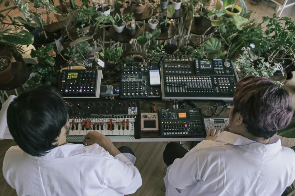 Indonesian electronic music group Bottlesmoker perform at the “Plantasia” concert in July to an audience of more than 150 house plants and their owners. Photo: Widian Lesmana