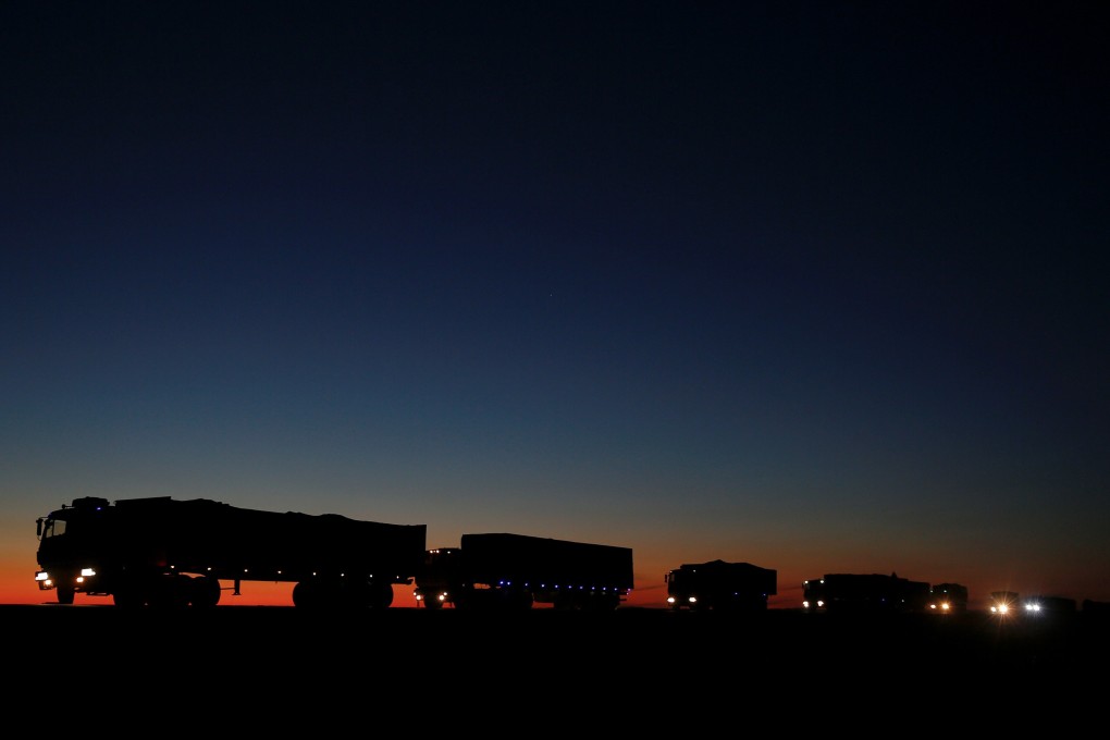 Trucks carrying coal from Mongolia on route to the border with China in Khanbogd Soum in the Gobi desert. Photo: Reuters