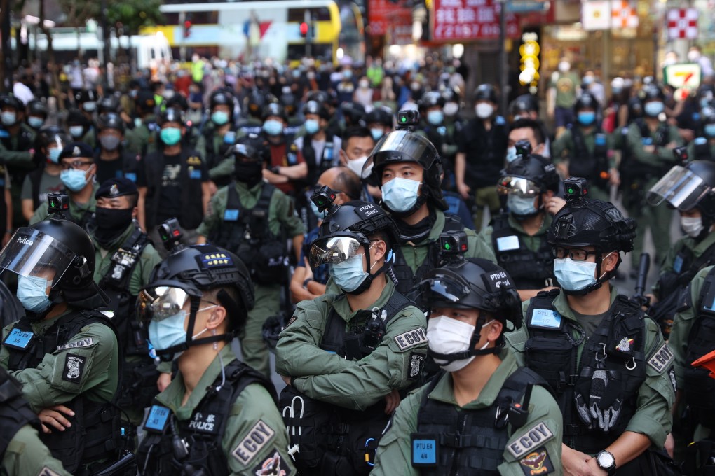 Police officers stand guard during a rally in Hong Kong in October. Photo: EPA-EFE