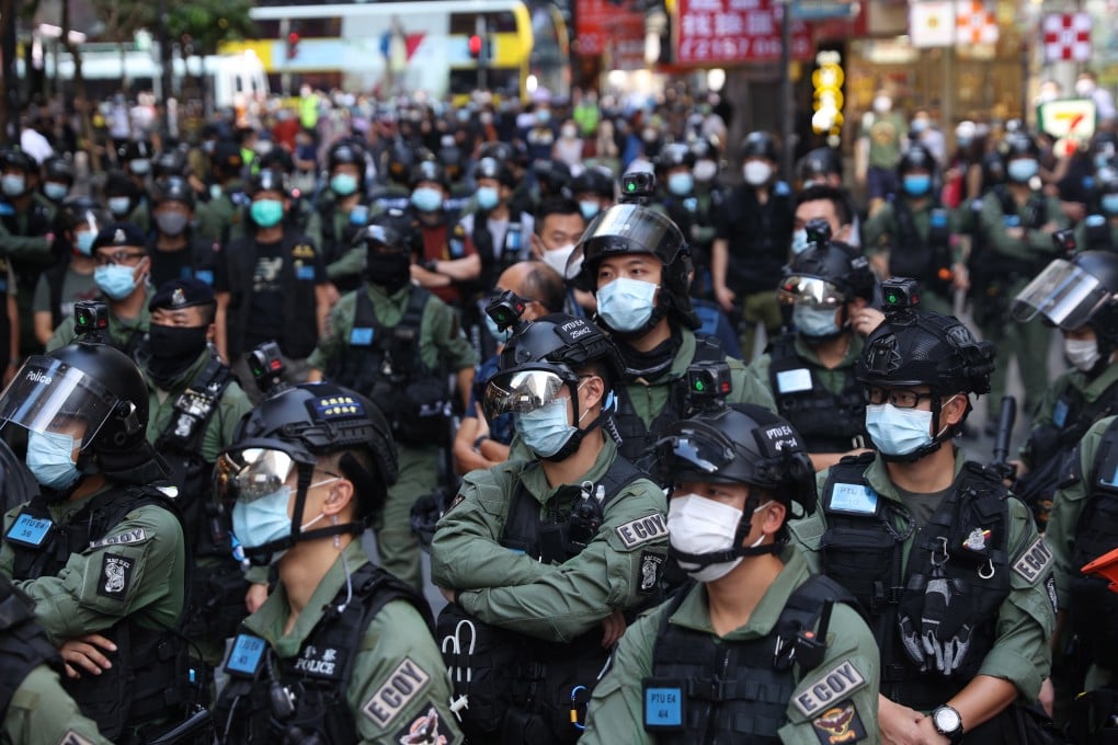 Police officers stand guard during a rally in Hong Kong in October. Photo: EPA-EFE