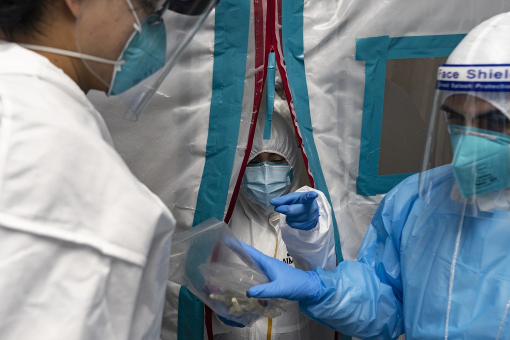 Medical staff in protective gear work at a hospital’s Covid-19 intensive care unit in Houston, Texas, on Sunday. Photo: Bloomberg