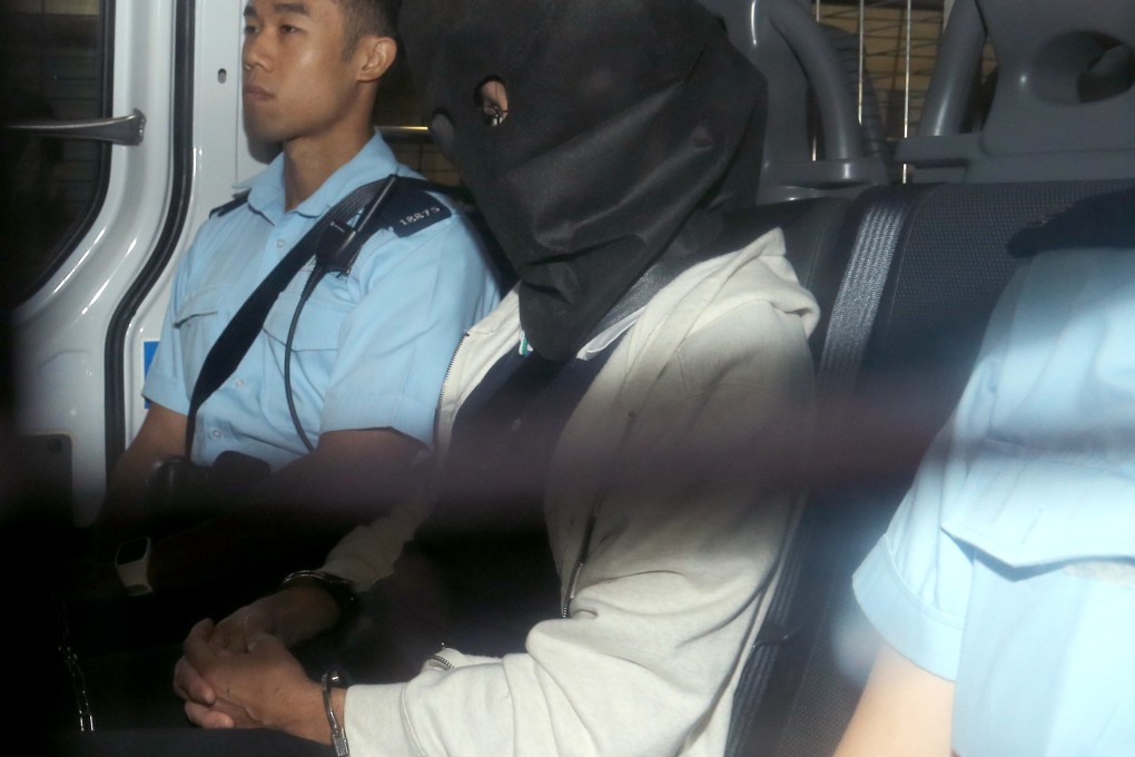 HKU associate professor Cheung Kie-chung (face covered) is accused of murdering his wife Chan Wai-man. Photo: Dickson Lee