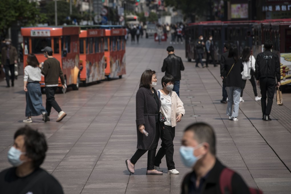 Pedestrians on the Nanjing Road shopping thoroughfare in Shanghai on Monday, April 20, 2020. Photo: Bloomberg