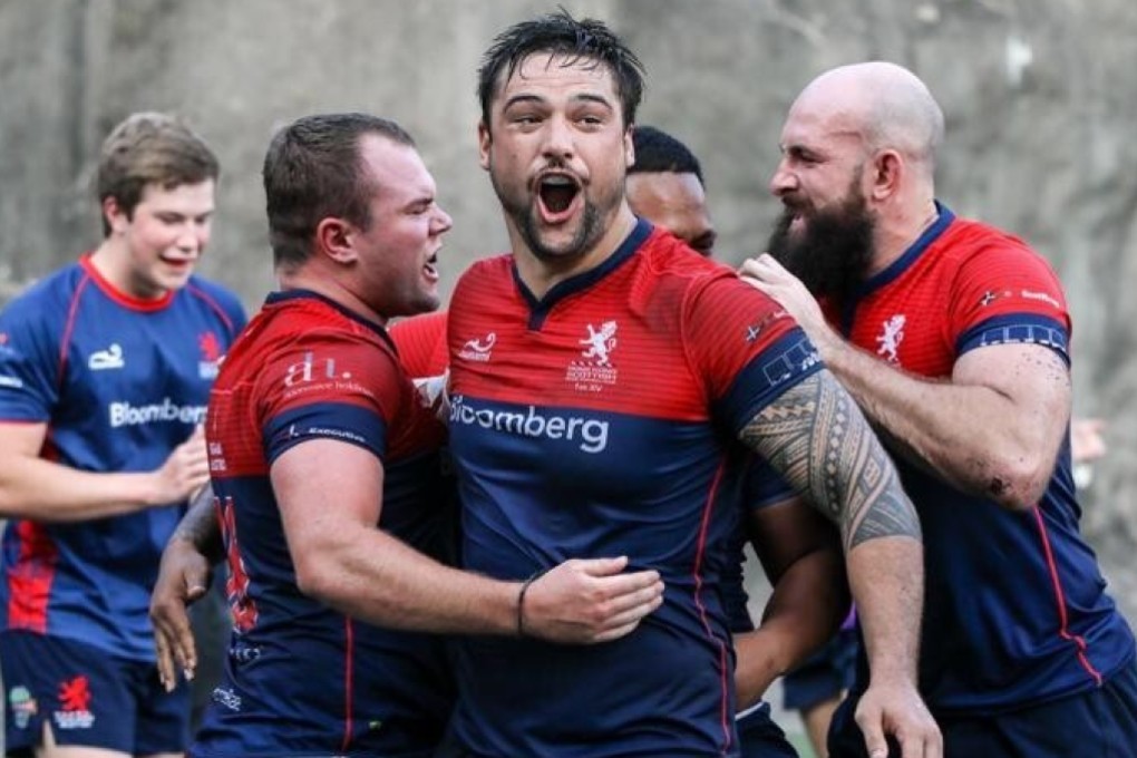 Hong Kong Scottish captain Joshua Dowsing celebrates with teammates after the team scores a try in the Premiership last season. Photo: Handout