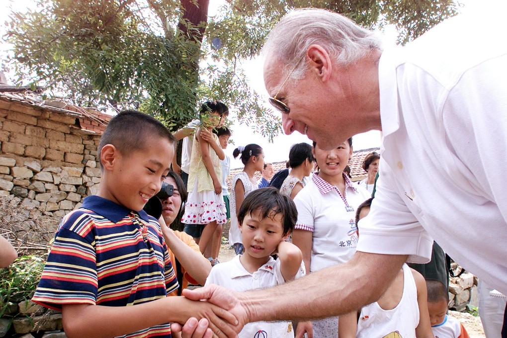 US president-elect Joe Biden shakes hands with nine-year-old Gao Shan during his visit to the Chinese village of Yanzikou in 2001. Photo: AP