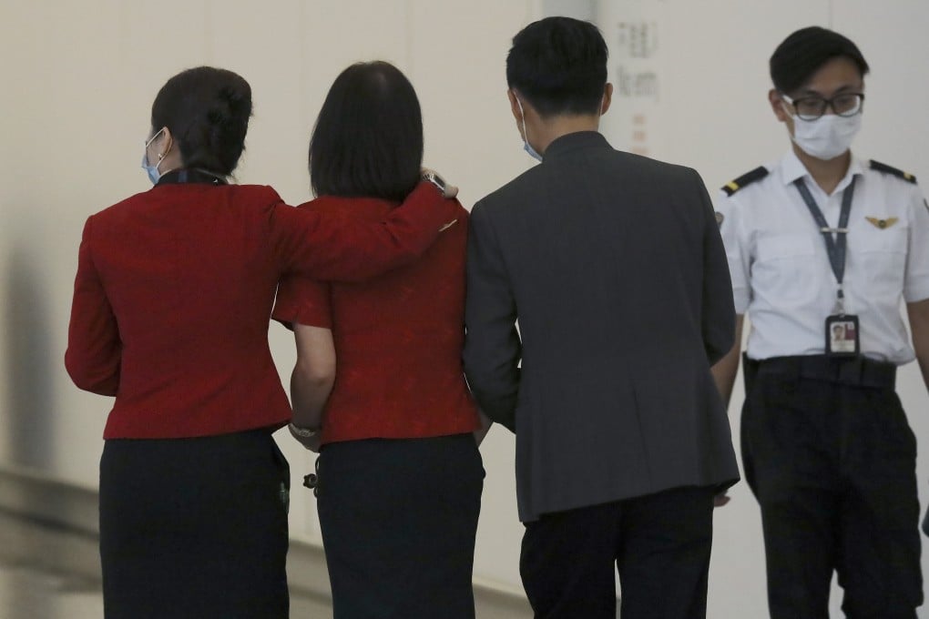 Cathay Pacific staff leave the airline’s check-in counters at the Hong Kong International Airport on October 21. Photo: K.Y. Cheng