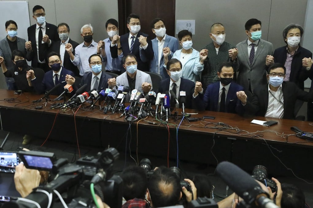 Hong Kong’s pro-democracy lawmakers at the Legislative Council building after four were disqualified. Photo: Dickson Lee
