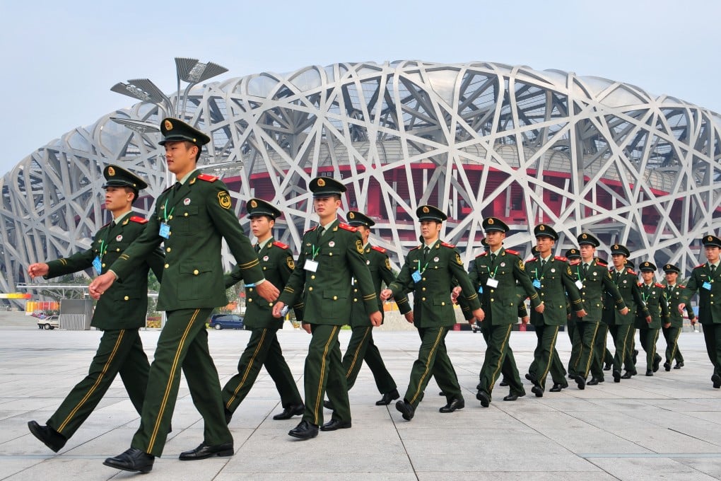 Soldiers march past Beijing’s National Stadium, aka the Bird’s Nest, ahead of the opening ceremony of the 2008 Summer Paralympics. Photo: AFP