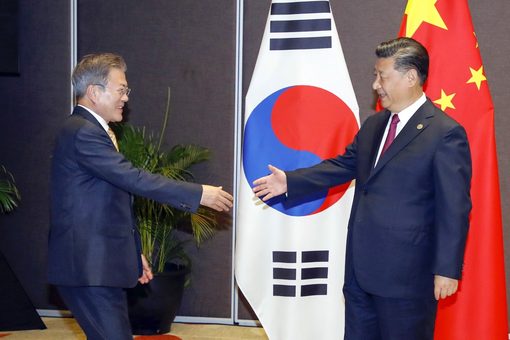 Chinese President Xi Jinping (right) and South Korean President Moon Jae-in meet on the sidelines of the Apec summit in Papua New Guinea in 2018 Photo: EPA-EFE