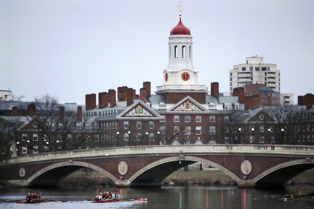 Rowers paddle along the Charles River past the Harvard University campus in Cambridge, Massachusetts in March 2017. Photo: AP