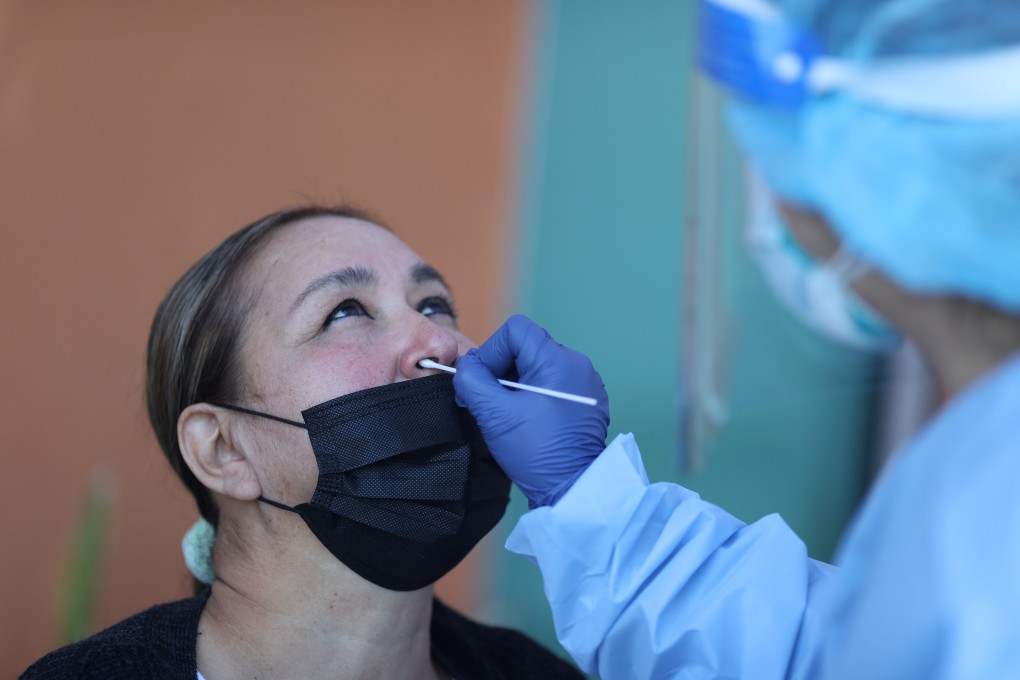 A woman is tested for Covid-19 at a hospital in Los Angeles. California has surpassed 1 million cases, with stricter restrictions imposed to curb the spread of the virus. Photo: Reuters