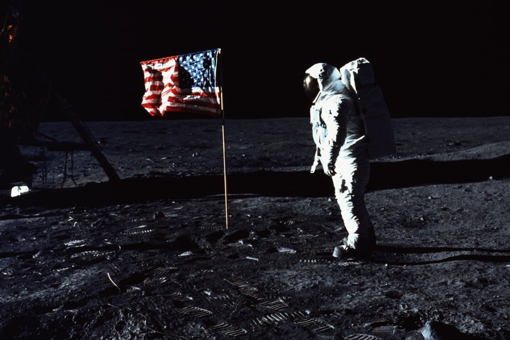 Astronaut Buzz Aldrin stands by the American flag on the surface of the moon on July 20, 1969. Photo: Getty Images
