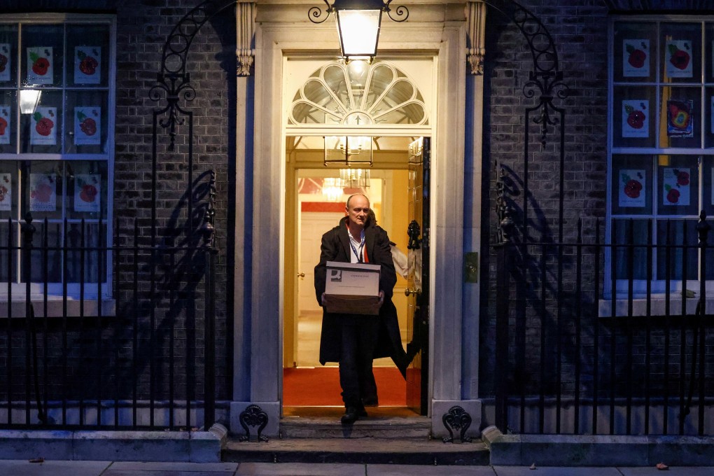 Dominic Cummings, special adviser for Britain's Prime Minister Boris Johnson, carries a box of possessions as he leaves 10 Downing Street in London on Friday. Photo: Reuters