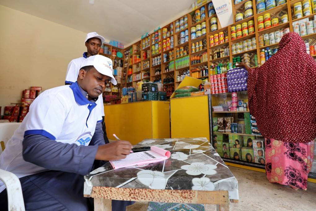 An online shop team records food orders transmitted with the World Food Programme in Wadajir district of Mogadishu, Somalia in October. Photo: Reuters