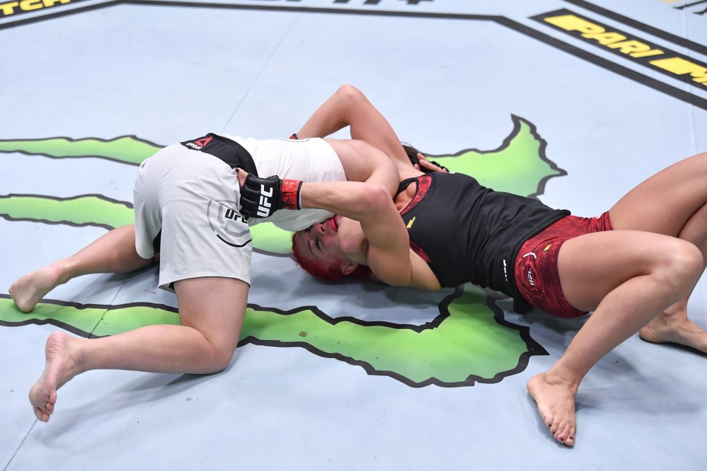 Japan’s Kanako Murata attempts to secure a choke submission against Randa Markos in a strawweight fight at UFC Fight Night in Las Vegas. Photos: Jeff Bottari/Zuffa LLC