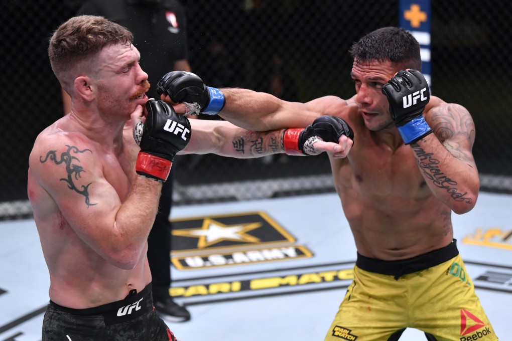 Brazil’s Rafael Dos Anjos (right) aims a punch at Paul Felder in their lightweight fight at UFC Vegas 14. Photos: Jeff Bottari/Zuffa LLC