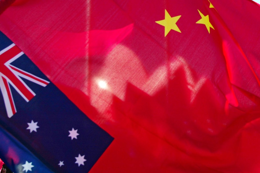 The Sydney Opera House is seen through a Chinese flag. Photo: AFP