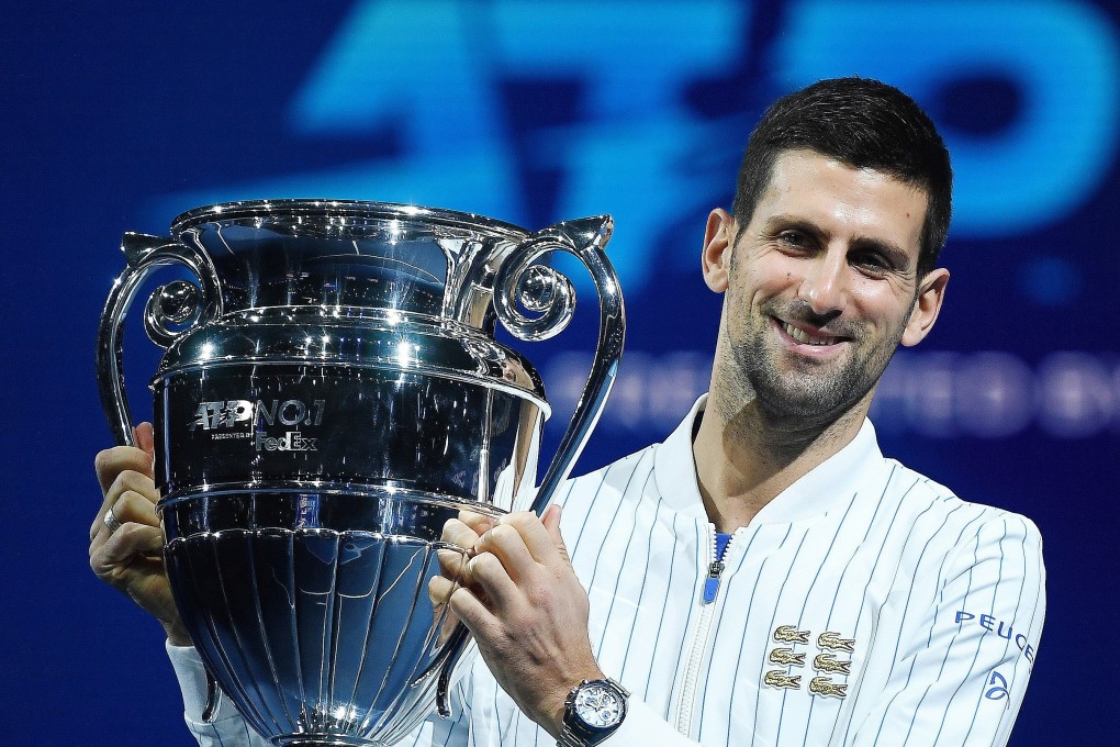 Serbia's Novak Djokovic holds the ATP World No 1 trophy at the Nitto ATP tennis finals in London on Sunday. Photo: EPA-EFE