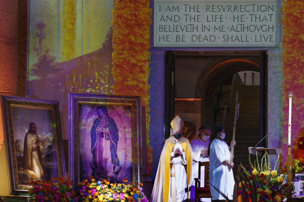 Los Angeles Archbishop José Gomez leads a virtual prayer service at the Mausoleum of Calvary Cemetery and Mortuary in East Los Angeles on November 1. Photo: AP