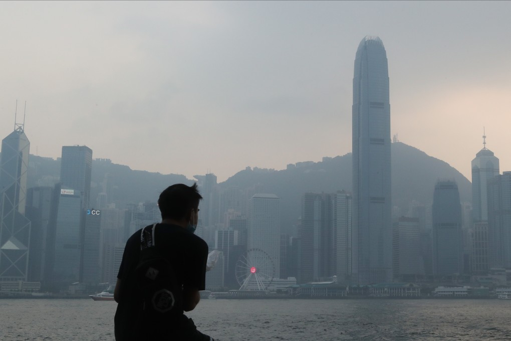 A man looks out over the Hong Kong skyline from Tsim Sha Tsui on September 1. The protests and imposition of a national security law have prompted some Hongkongers to consider moving out of the city. Photo: Edmond So